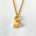 Gold stainless steel necklace with pink gemstone and engraved initial H pendant tag - Letter H