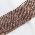Macro detail of 2mm faceted crystal flat beads in metallic bronze for DIY jewelry making - 2mm (Approx. 210 Beads per Strand) / Red Gun Black