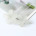 Elegant matte white flower hair clip with a translucent frosted finish in a u-shaped design - Milky Yellow