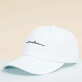 Detail shot of white baseball cap with black Freedom cursive embroidery and vent holes - One Size / White