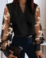 Detail des V-Ausschnitt-Tops mit transparenten Netzärmeln und goldener Stickerei - S / Schwarz Gold Floral