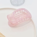 Close-up of pink translucent acetate hair claw clip with aurora texture on ceramic plate - 10# Pink Mermaid PVC Claw