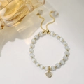 Adjustable white cat eye bead bracelet with golden heart pendant and crystals - Opal Heart Adjustable Style