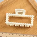 Elegant rectangular pearl hair claw clip with gold spring on wooden tray 10cm - Hollow Square