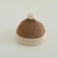 Detail of baby corduroy beanie featuring a plush pom-pom and ribbed knit fold-over brim - 50-52cm (2-4 Years) / Khaki Patchwork Beige