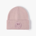 Pink rib-knit beanie with embroidered smiley face detail for winter outdoor style - One Size / Pink
