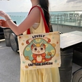 White canvas tote bag with red handles and a colorful cartoon dragon print design - Little Dragon Man