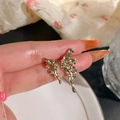 Handheld vintage butterfly wing earrings in gold with purple and white cubic zirconia - Rhinestone Butterfly Wing