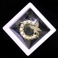 Elegant gold butterfly pearl brooch displayed in a white PE film floating gift box - Circle Butterfly Style (XZ124)