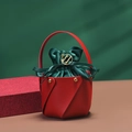 Red leather and green velvet Christmas gift bag with a gold Merry Christmas tag and handle - Red Bucket + Green Velvet Bag