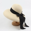 Women's summer straw sun hat in beige with large black satin bow tie detail - Adjustable / Beige