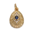 Macro view of gold evil eye pendant with blue gemstone and clear crystals - Oval Blue Eye Pendant