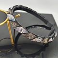 Luxe black headband with shimmering rhinestones and non-slip teeth on a gold stand - Clear Grey AB Rhinestone
