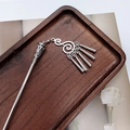 Macro detail of silver tassel hair pin with vintage Chinese fringe on a wooden tray - F0742 Hair Stick-29# (Bright Silver Spiral Tubular Tassel)