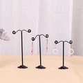 Set of 3 black metal earring display stands in varying heights with star earrings - Coil/Spiral Shape / Black
