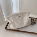 Detail of cream white cotton makeup bag featuring floral embroidery and simple wish label - Small Size