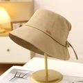 Elegant khaki cotton bucket hat for women with golden label and bow tie detail - Khaki