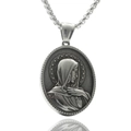 Macro shot of silver stainless steel pendant featuring Virgin Mary relief with starry border - Virgin Mary
