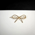 Minimalist golden metal bow hair clip with geometric alloy design and glossy finish - Gold Bowknot