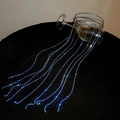 Detail of blue rhinestone fringe chains draped over a glass on dark background - Silver Blue Zircon Multi-layer Tassel Style
