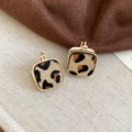 Close-up of square leopard print earrings with 18K gold plated frame on soft fabric - Ear Clip - Gold - Light Coffee (18K Gold Plated)