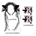Detail of black lace cat ear headband and matching wristbands with pink bows and bells - Black Lace Cat Ears + Lace Bell Wristbands