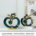 Modern set of two green and gold apple ceramic figurines with hollow heart design - Green Gold Heart Apple Pair