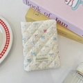 Quilted cream passport cover with colorful bow and rabbit prints and woven brand label - Star Rabbit