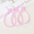 Three pink silicone cable ties with non-slip texture for securing cords and accessories - Luminous Purple