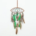 Brown and green dream catcher with spotted feathers and wood beads on a white background - Green Eye (Eye)