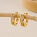 Macro detail of gold huggie earrings with triple-row pavé zircon on natural branches - EH412019 Three Row Micro Pave