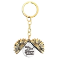Detailed macro view of an antique gold sunflower keychain with engraved inspirational quote - T00011 Gold Sunflower Silver Disc (With God all things are possible)