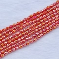 Dettaglio macro di perle sfaccettate arancioni a goccia con finitura perlata per gioielli - 4*5mm (circa 95pz/filo) / Rosso Porcellana AB