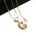 Detailed close-up of gold plated letter G pendant with colorful zircon and heart charm - Pendant with Necklace / Letter G