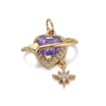 Macro shot of gold heart Saturn charm with purple gemstone and star pendant details - Purple Heart Planet