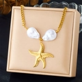 Detail of gold starfish necklace featuring two large white baroque pearls on jewelry box - Irregular Pearl Gold Starfish Necklace (N3445)