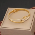 Elegant gold butterfly bangle with micro-pave crystals on a beige jewelry display box - Double Frosted Butterfly Streamline Style (6#)