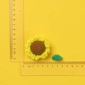 Handmade crochet sunflower keychain in yellow yarn with green leaf and scale measurement - Small Sunflower with Leaf Set