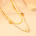 Detail view of gold double layer butterfly necklace on beige leather background - Gold White Shell Butterfly Necklace (O610)