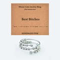 Detail of Morse Code fidget ring with movable beads on a handmade display card - Best Bitches