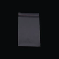 Transparenter Kunststoff-Selbstklebebeutel mit rotem Verschlussstreifen auf schwarzem Grund - Transparente Verpackungstasche (Eine Tasche)
