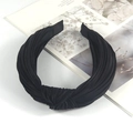 Detail view of the black pleated fabric texture and twisted knot design of the headband - Premium Black