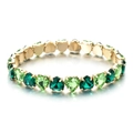 Chic gold heart-shaped bracelet with green zircon crystals on a white background - Green Mix