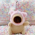 Cute capybara plush keychain in pink hooded outfit on macaron foam balls background - Pig Hat Light Brown + Bead Chain