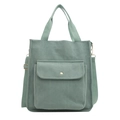 Green corduroy tote bag with front pocket and adjustable strap on white background - Green