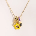 Detailed view of titanium steel necklace with colorful enamel charms and zircon stones - Style 1 Gold