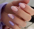 Detailed view of lilac and nude oval press-on nails with white wave lines and french tip - Lilac Nude Patchwork Style (CW51)