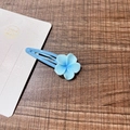 Sweet blue resin flower hair clip with metal base on a dark wood background - 8# Light Blue Frangipani