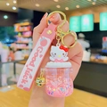 Pink cartoon spaceman quicksand keychain with Hello Kitty style design and gold bell - Bubble Bottle - Hello Kitty
