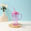 Pink gradient plastic tumbler with handle, lid, and straw on a wooden stand - 20oz / Pink